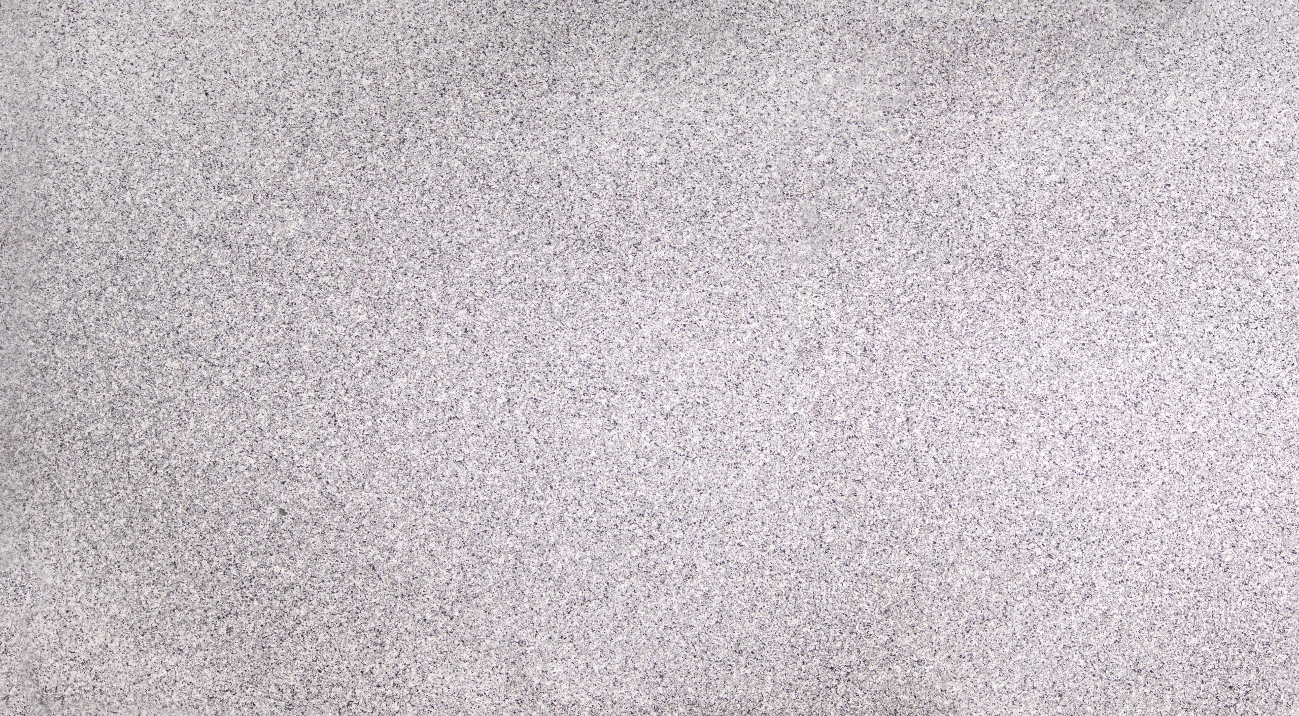 Premium White Natanz Granite slab with uniform fine-grained texture